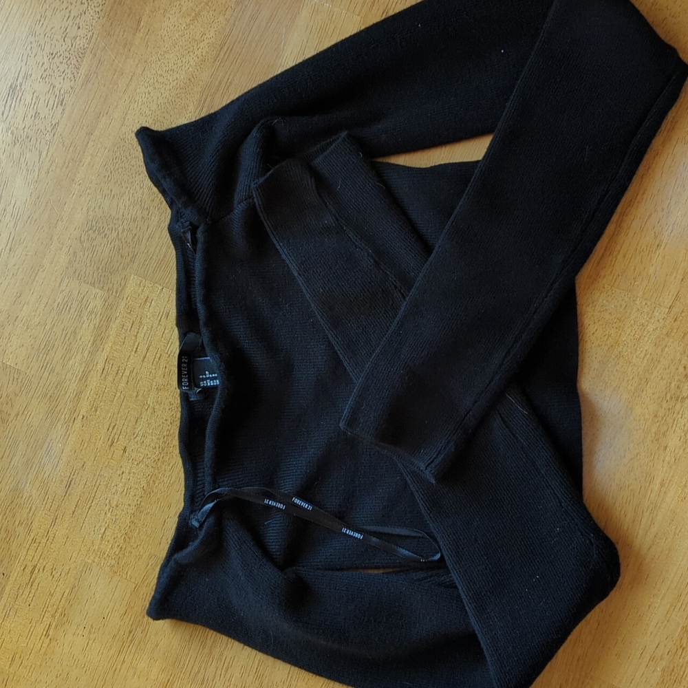 Off-the-shoulder black sweater